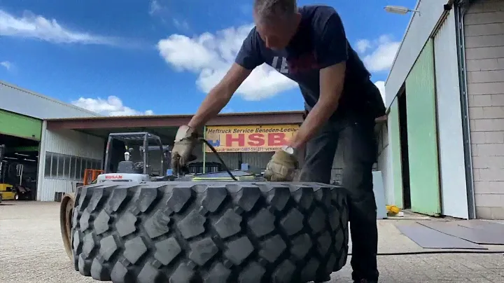 Getting the wheel (102kg) of the rim (50kg) 😅 Michelin XZL 14.00R20